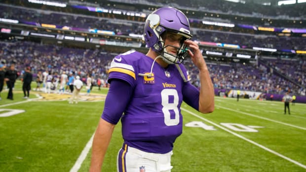 Vikings quarterback Kirk Cousins (8) walks off the field after a loss to the Chargers.